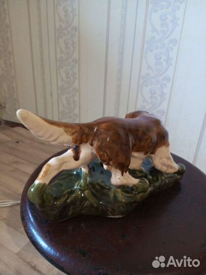 Собака с уткой