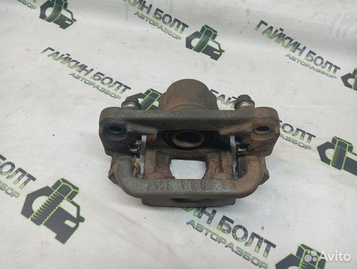 Суппорт тормозной задний правый Nissan Qashqai J10