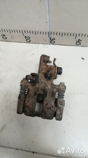 Суппорт задний правый Nissan Almera Tino