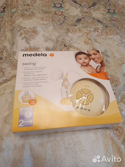Молокоотсос электрический medela