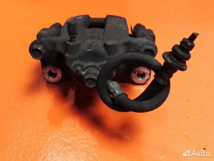 Суппорт тормозной задний левый Nissan Pathfinder