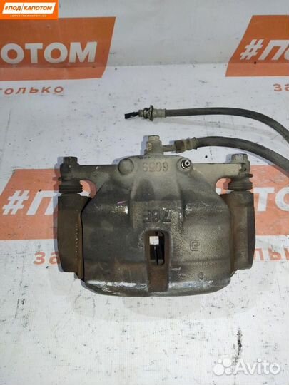 Суппорт тормозной передний левый Nissan X-Trail