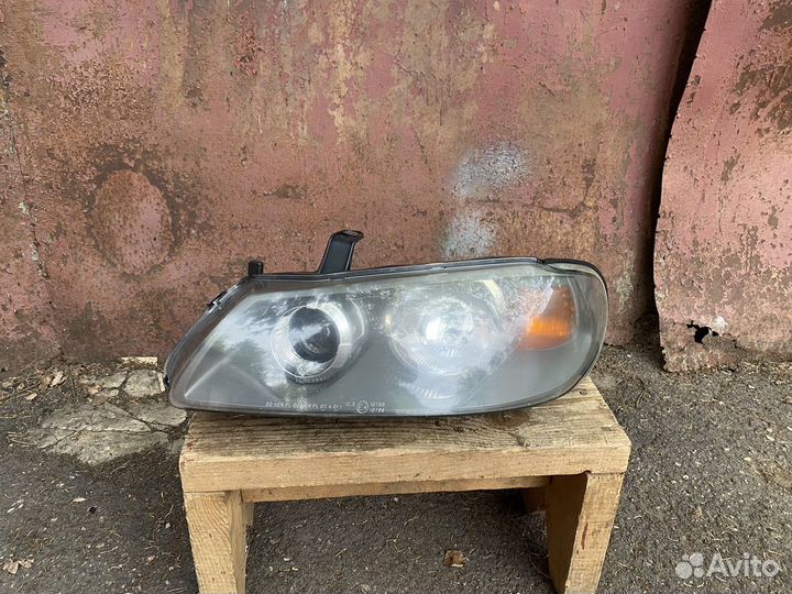Левая фара Nissan Almera N16