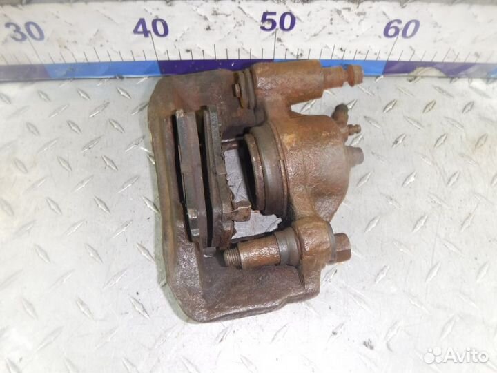 Суппорт тормозной передний левый Kia Rio