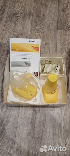 Молокоотсос medela электрический