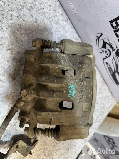 Суппорт передний левый Tociko