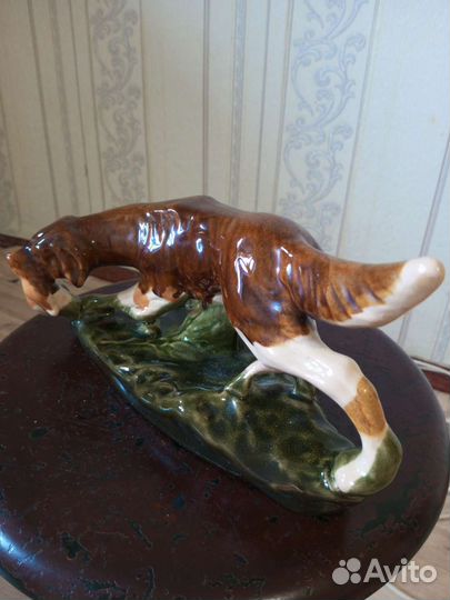 Собака с уткой