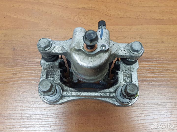 Суппорт задний левый Sportage (QL) 2016-2021