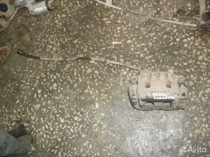 Суппорт передний левый (Subaru Forester)