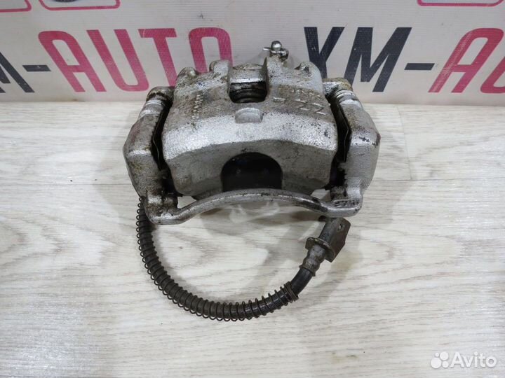 Суппорт тормозной передний левый Kia Rio 3