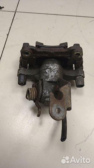 Суппорт задний левый Nissan Primera