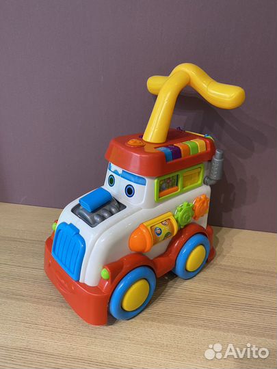 Паровоз каталка развивающий центр музыкальный