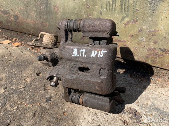 Суппорт задний правый Nissan Almera N15