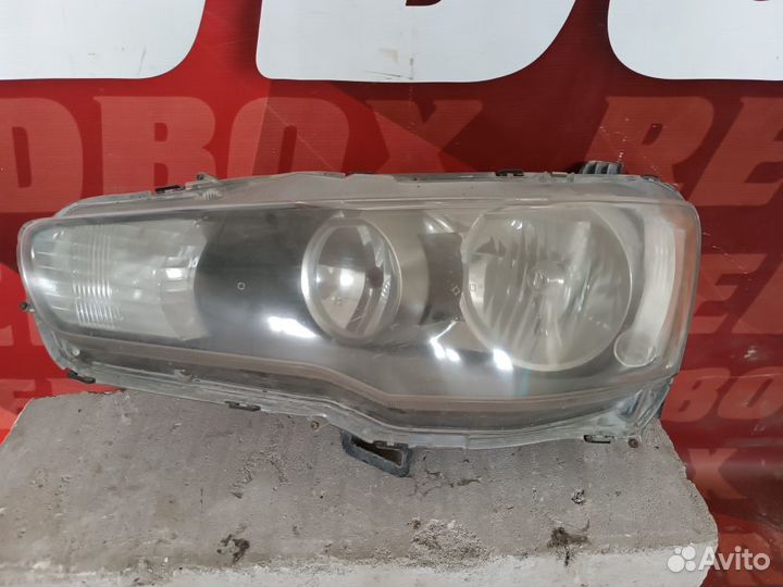 Фара левая Mitsubishi Lancer 10 8301C335