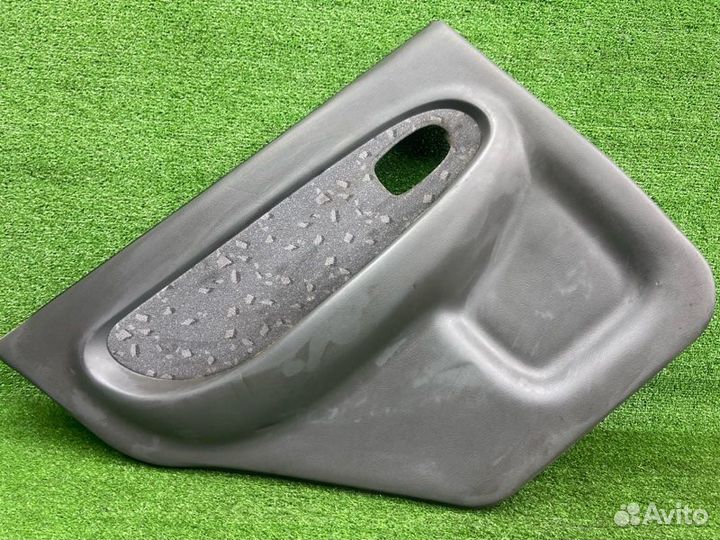 Обшивка двери задняя левая Kia Spectra