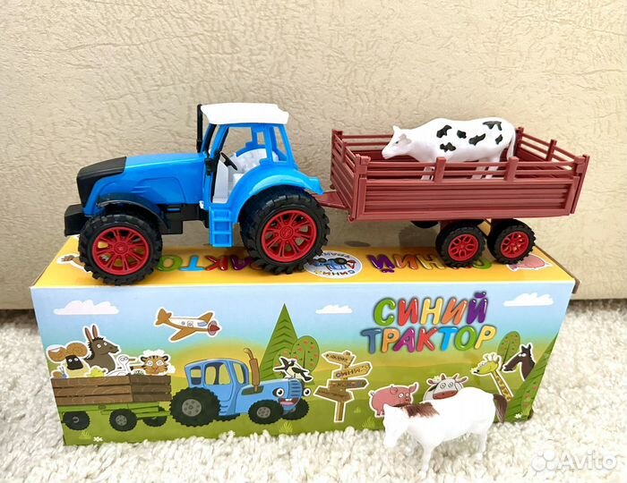 Синий трактор с животными
