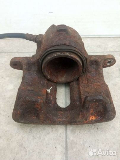 Суппорт тормозной передний левый Renault Espace 3