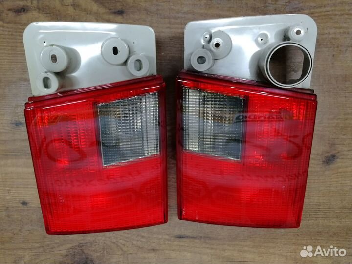 Фонари задние audi А6C4 hella в крышку багажника