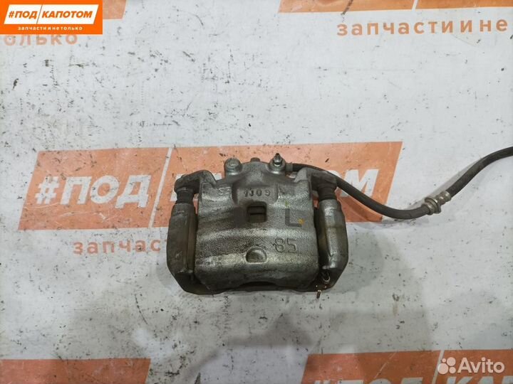 Суппорт тормозной передний левый Nissan Teana J32