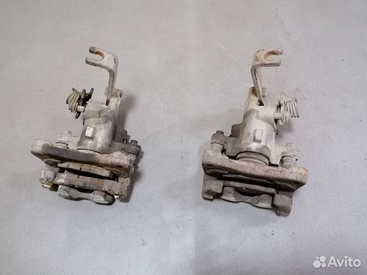 Суппорт тормозной задний Nissan Primera P11