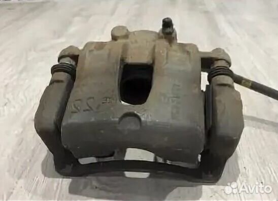 581801RA00 супорт тормозной Hyundai Solaris левый