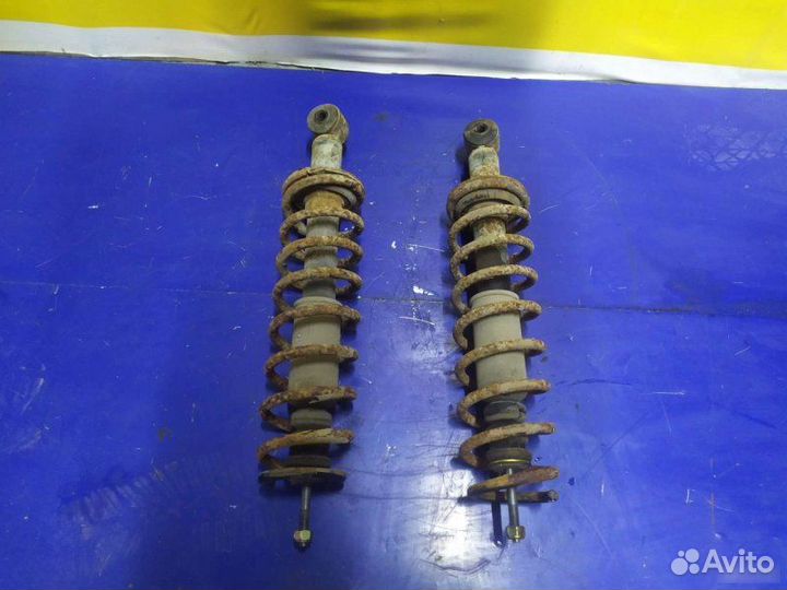 Стойка амортизатора задняя Mitsubishi Lancer 9