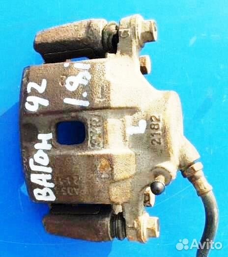 Суппорт левый передний Мицубиси Спэйс Вагон