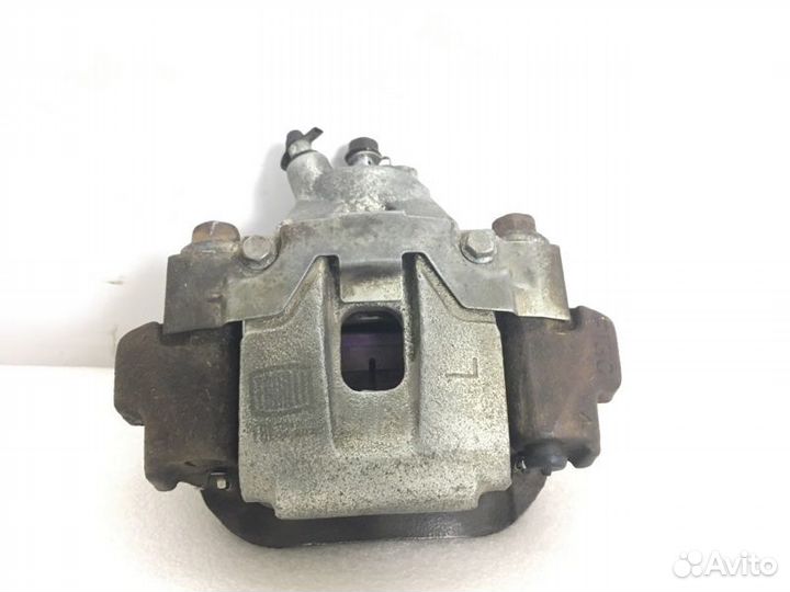 Суппорт тормозной задний левый Lexus Lx570