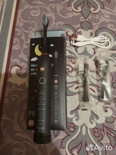 Электрическая зубная щетка