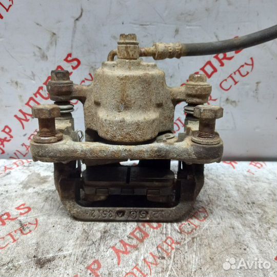 Суппорт тормозной задний левый Nissan X Trail T30