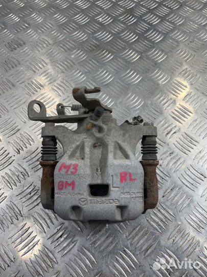 Суппорт задний левый Mazda 3 BM
