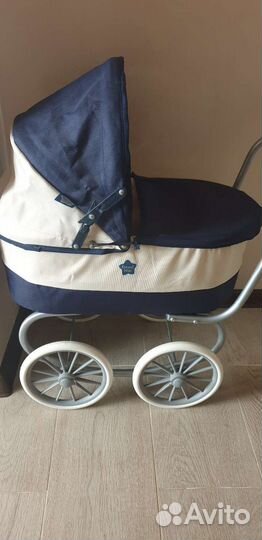 Детская игрушечная коляска