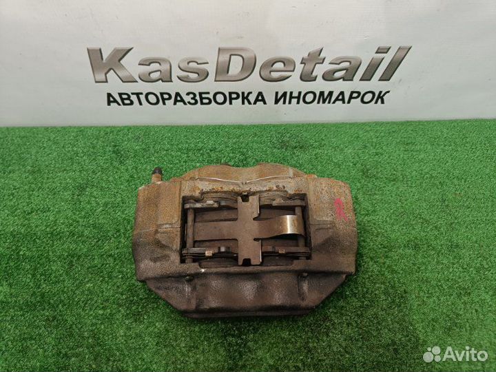 Суппорт тормозной передний правый Toyota Land