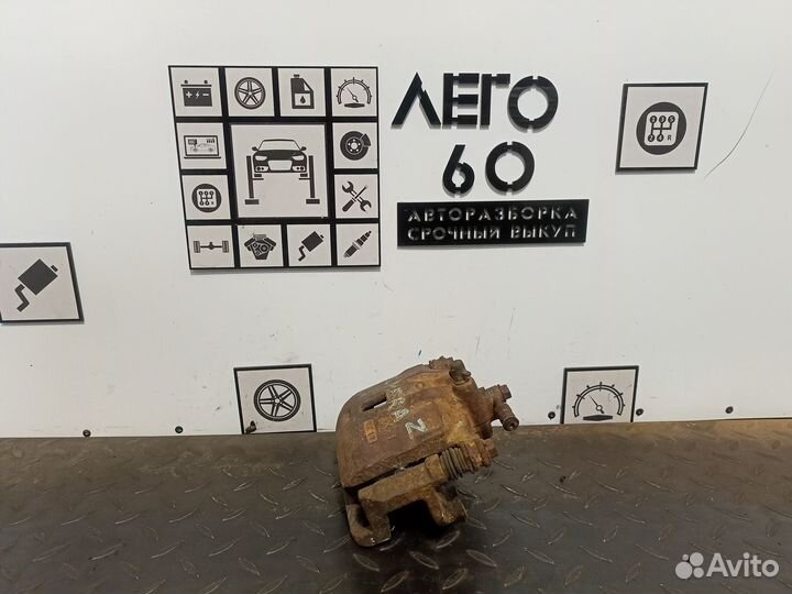 Суппорт тормозной левый Nissan Almera Classiс B10