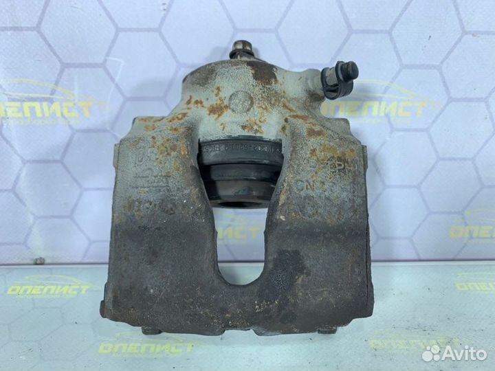 Суппорт тормозной передний левый Opel Astra G