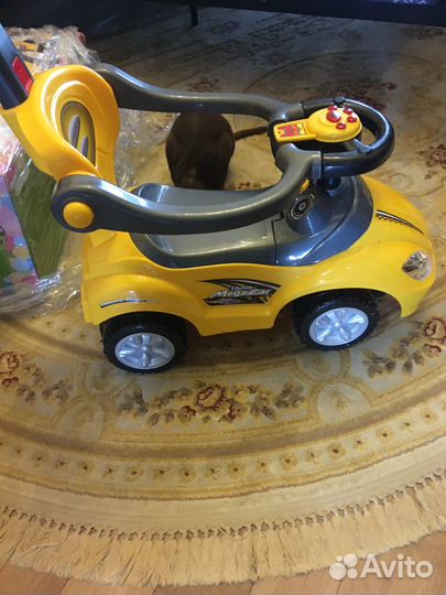 Детская машинка каталка музыкальная