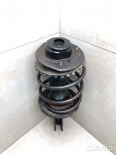 Амортизатор стойка передний левый Dodge Caravan 4