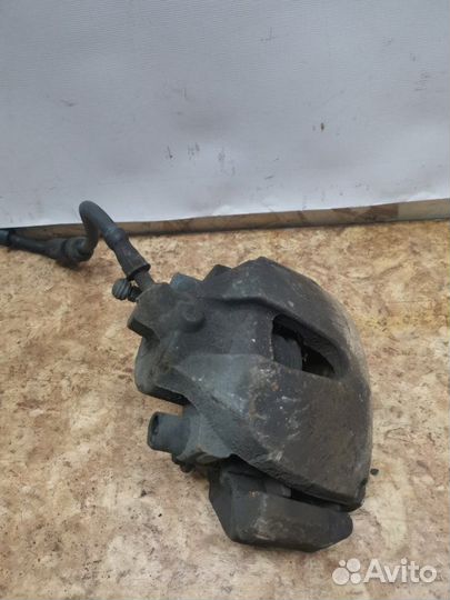 Суппорт тормозной передний левый Ford Focus 2