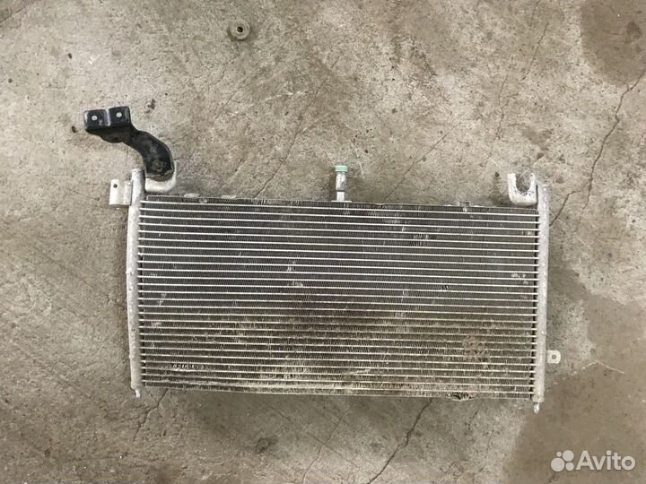 Радиатор кондиционера (конденсер) (Mazda 323)