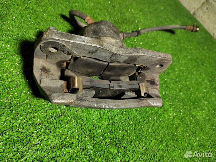 Суппорт тормозной передний левый Kia Spectra 1 S6D