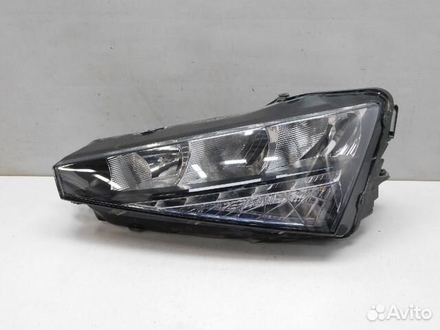 Фара левая Skoda Rapid