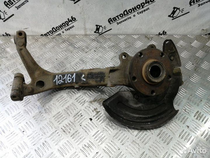 Кулак поворотный передний левый Passat B5