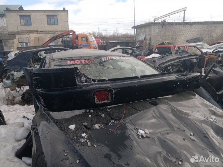 Бампер задний Mazda Demio 1998