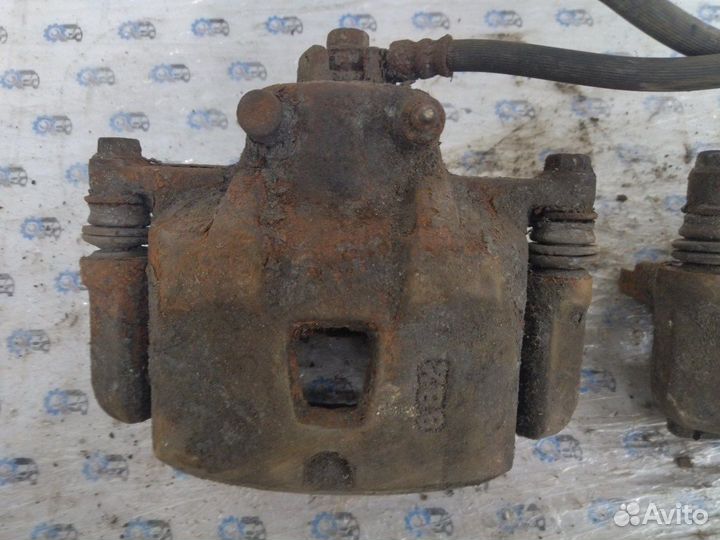 Суппорт передний Mazda 323 Bj