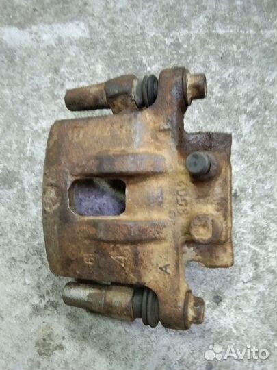 Суппорт задний Митсубиси Лансер 10