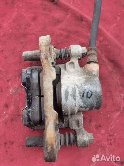 Суппорт задний Митсубиси Лансер 10 правый