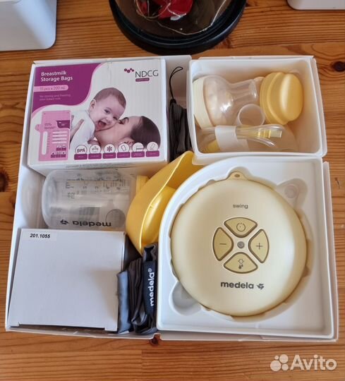 Молокоотсос medela электрический