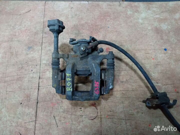 Суппорт тормозной задний правый Опель Астра J