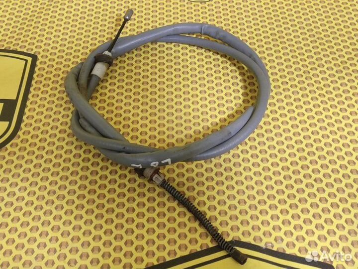 Трос стояночного тормоза левый Renault Logan L8