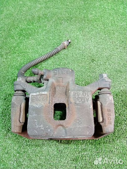 Суппорт тормозной задний левый Mitsubishi Pajero